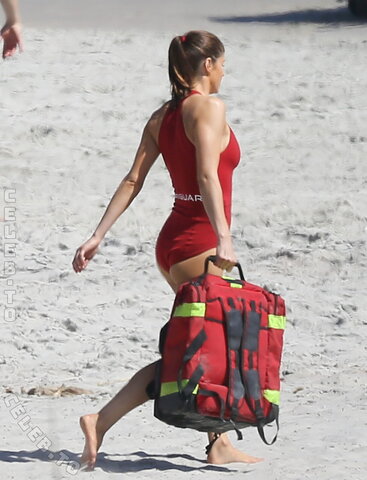 Alexandra Daddario wearing the red bikini while on set of “Baywatch” in Tybee, Georgia March 25, 2016