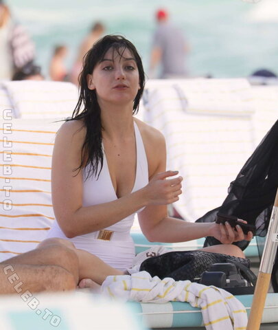 Daisy Lowe in a White Swimsuit on the Beach in Miami 12/30/2015