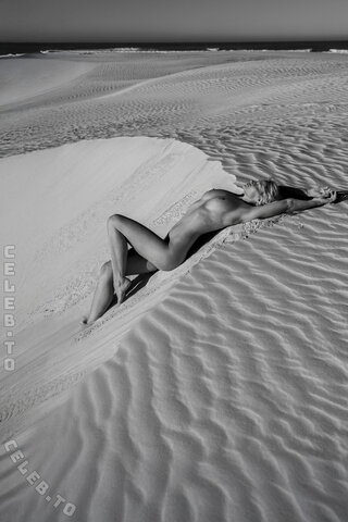 Genevieve Morton - stretches nude out on the sand of South Africa 07/2026