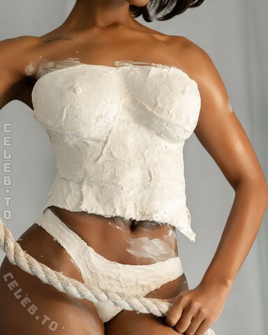 Normani - in the side-angle shots, the plaster top reveals a completely naked bare back 06/2026
