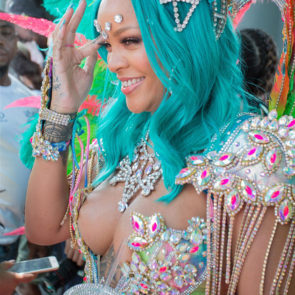 Rihanna smiling in sexy costume