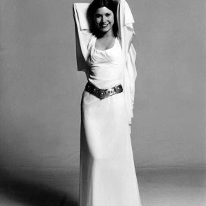 Carrie Fisher posing in white dress